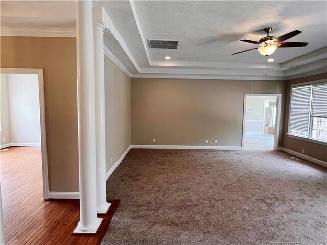 333 Westwater Way, Fayetteville, NC 28301 - carpeted empty room with ornate columns, ceiling fan, a raised ceiling, and ornamental molding