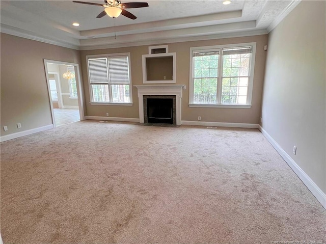 333 Westwater Way, Fayetteville, NC 28301 - unfurnished living room with a raised ceiling, healthy amount of natural light, ceiling fan, carpet, and ornamental molding