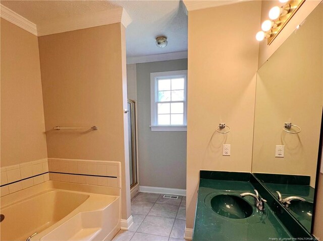 333 Westwater Way, Fayetteville, NC 28301 - bathroom with a garden tub, ornamental molding, a stall shower, vanity, and tile patterned floors