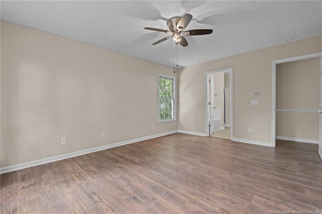40 Blue Heron Ct, Sanford, NC 27332 - unfurnished bedroom featuring wood finished floors, ceiling fan, and connected bathroom