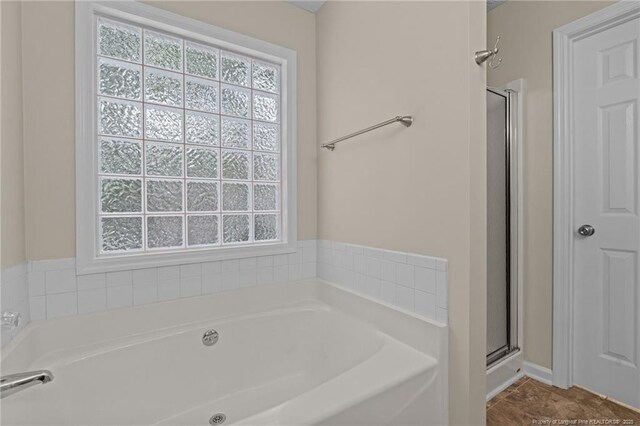 40 Blue Heron Ct, Sanford, NC 27332 - bathroom featuring a bath, a stall shower, and tile patterned floors