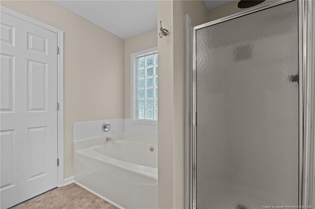 40 Blue Heron Ct, Sanford, NC 27332 - full bathroom featuring a stall shower, a garden tub, and tile patterned floors