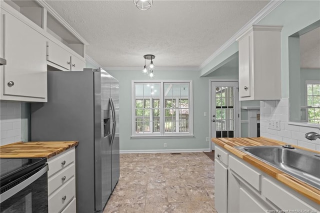 40 Blue Heron Ct, Sanford, NC 27332 - kitchen with electric range, wood counters, backsplash, white cabinetry, and crown molding