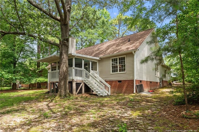 40 Blue Heron Ct, Sanford, NC 27332 - back of property with crawl space, stairway, a chimney, and a sunroom