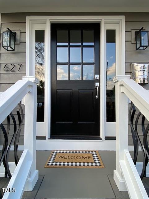 627 New Rd, Raleigh, NC 27608 - doorway to property featuring covered porch