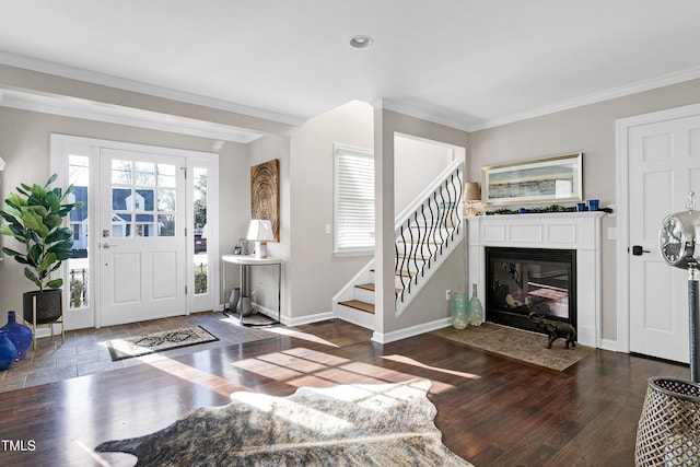 627 New Rd, Raleigh, NC 27608 - entrance foyer with crown molding, wood finished floors, stairway, a fireplace with flush hearth, and recessed lighting