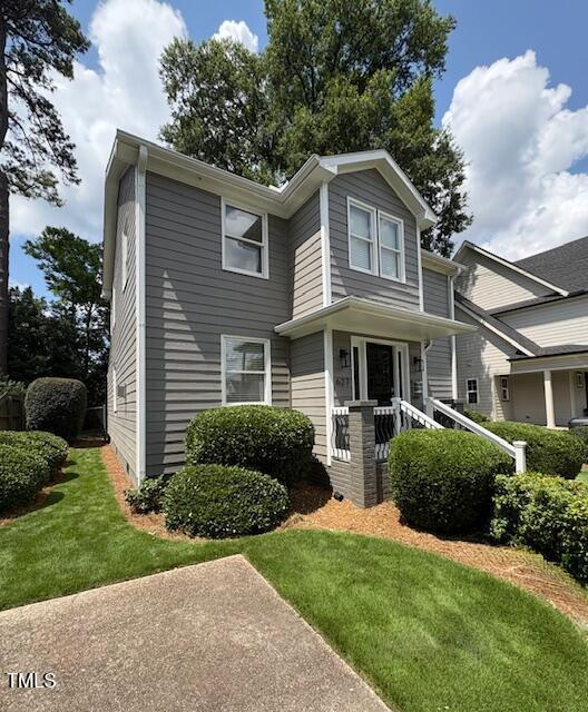 627 New Rd, Raleigh, NC 27608 - view of front facade with a front yard