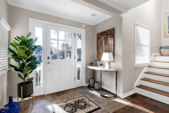 627 New Rd, Raleigh, NC 27608 - entryway featuring ornamental molding, stone tile flooring, and stairway