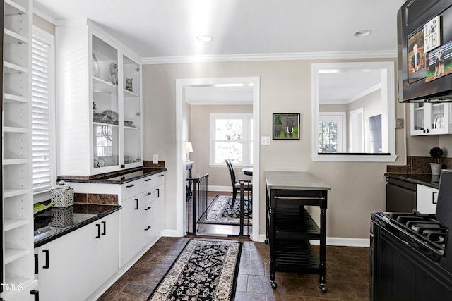 627 New Rd, Raleigh, NC 27608 - kitchen featuring black range with gas stovetop, ornamental molding, white cabinets, open shelves, and dark stone counters