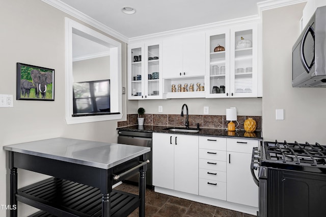 627 New Rd, Raleigh, NC 27608 - kitchen featuring appliances with stainless steel finishes, white cabinets, glass insert cabinets, dark stone countertops, and recessed lighting