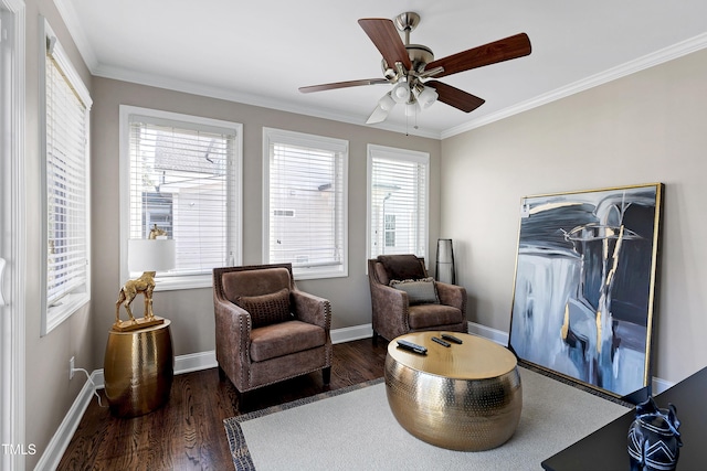 627 New Rd, Raleigh, NC 27608 - living area featuring dark wood-style flooring, crown molding, and a ceiling fan