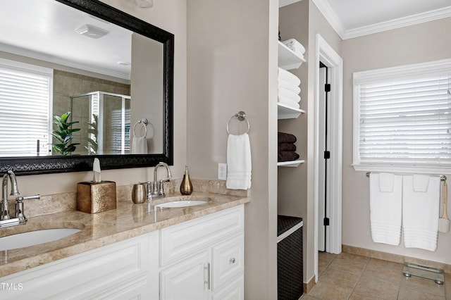627 New Rd, Raleigh, NC 27608 - full bathroom featuring double vanity, a stall shower, crown molding, and tile patterned flooring