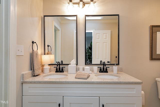 627 New Rd, Raleigh, NC 27608 - bathroom featuring double vanity and crown molding