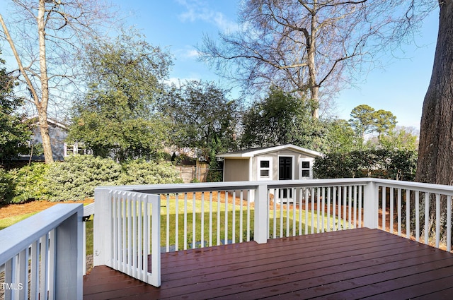 627 New Rd, Raleigh, NC 27608 - wooden deck with an outdoor structure and a lawn