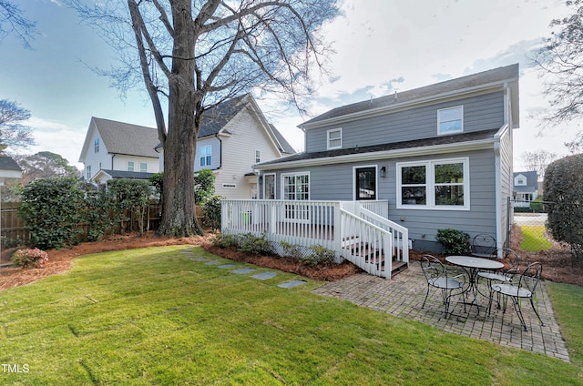 627 New Rd, Raleigh, NC 27608 - rear view of house with a wooden deck, a fenced backyard, and a patio