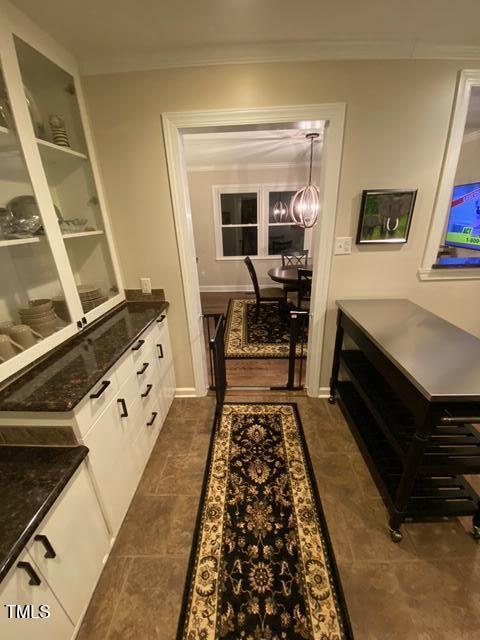 627 New Rd, Raleigh, NC 27608 - hall featuring crown molding
