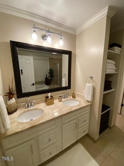 627 New Rd, Raleigh, NC 27608 - full bath featuring tile patterned floors, double vanity, and ornamental molding