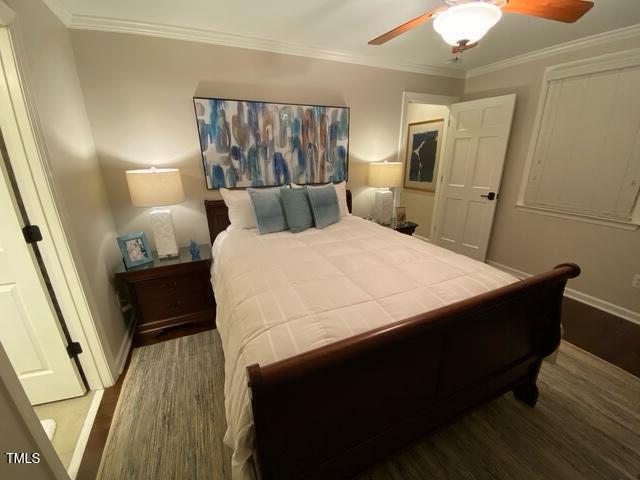 627 New Rd, Raleigh, NC 27608 - bedroom with wood finished floors, a ceiling fan, and ornamental molding