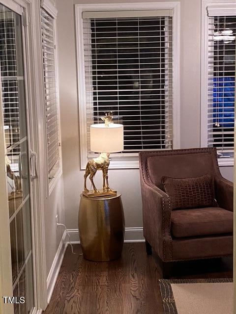 627 New Rd, Raleigh, NC 27608 - sitting room featuring baseboards and wood finished floors