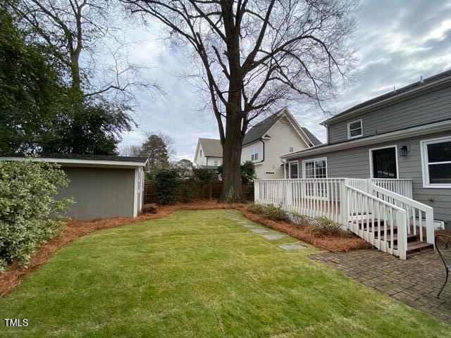 627 New Rd, Raleigh, NC 27608 - view of yard with a wooden deck