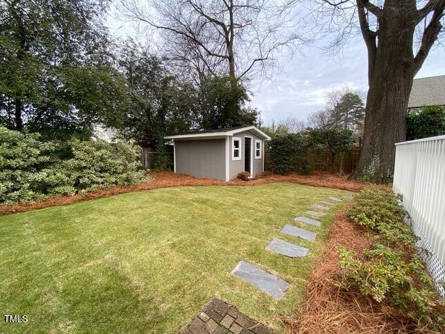 627 New Rd, Raleigh, NC 27608 - view of yard with an outbuilding