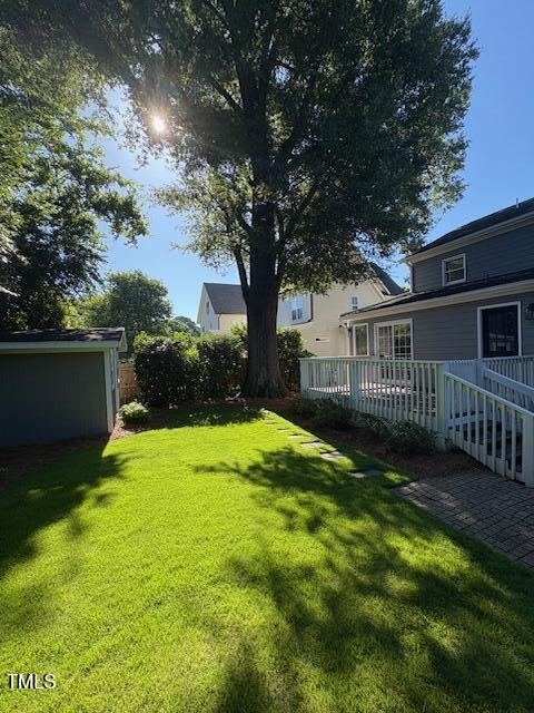 627 New Rd, Raleigh, NC 27608 - view of yard featuring a wooden deck
