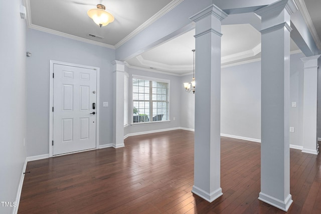 1104 Gaston Manor Dr, Durham, NC 27703 - foyer entrance featuring decorative columns, dark wood-type flooring, and ornamental molding