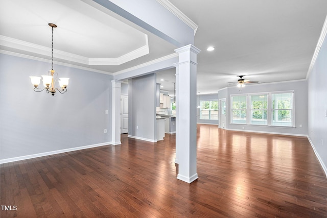 1104 Gaston Manor Dr, Durham, NC 27703 - unfurnished living room featuring ornate columns, a ceiling fan, crown molding, dark wood-style flooring, and a chandelier