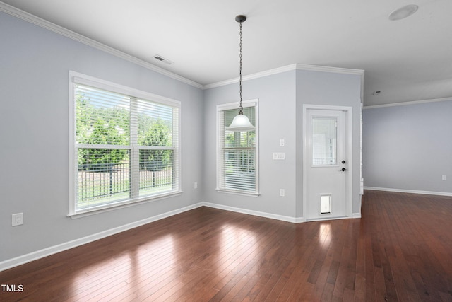 1104 Gaston Manor Dr, Durham, NC 27703 - unfurnished dining area with dark wood-style floors and ornamental molding