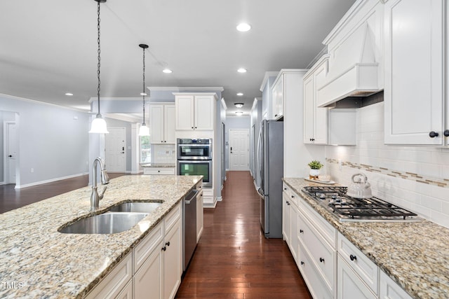 1104 Gaston Manor Dr, Durham, NC 27703 - kitchen featuring appliances with stainless steel finishes, dark wood-style flooring, decorative backsplash, white cabinetry, and recessed lighting