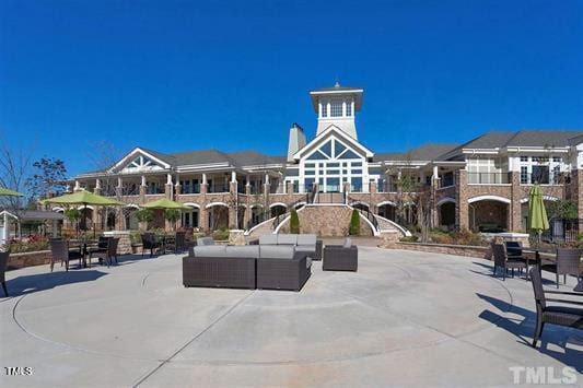 1104 Gaston Manor Dr, Durham, NC 27703 - view of community featuring an outdoor living space and a patio area