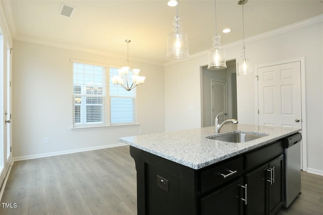 319 Great Northern Sta, Apex, NC 27502 - kitchen with dishwasher, crown molding, wood finished floors, a chandelier, and light stone countertops