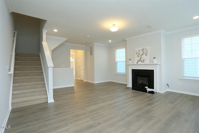 319 Great Northern Sta, Apex, NC 27502 - unfurnished living room featuring wood finished floors, plenty of natural light, crown molding, stairs, and recessed lighting