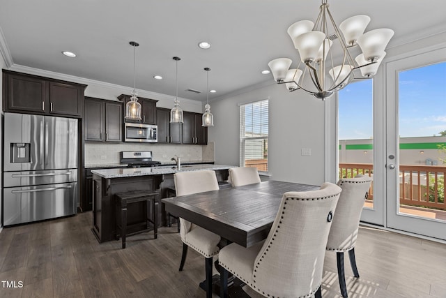 319 Great Northern Sta, Apex, NC 27502 - dining area featuring dark wood finished floors, a chandelier, ornamental molding, and recessed lighting