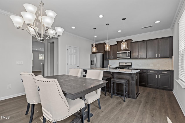 319 Great Northern Sta, Apex, NC 27502 - dining space featuring dark wood-style flooring, recessed lighting, a chandelier, and ornamental molding