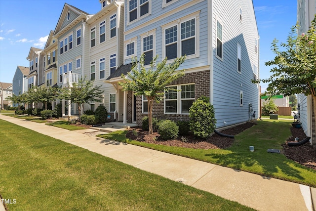 319 Great Northern Sta, Apex, NC 27502 - view of property featuring brick siding, a residential view, and a front yard