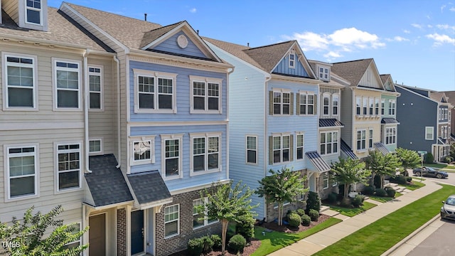 319 Great Northern Sta, Apex, NC 27502 - view of property exterior with a shingled roof, a residential view, and brick siding