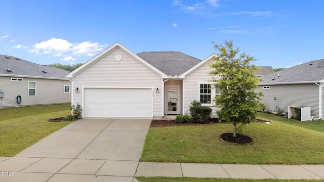 119 Yadkin St, Clayton, NC 27520 - ranch-style home featuring a garage, driveway, and a front lawn