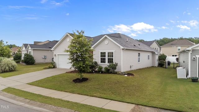 119 Yadkin St, Clayton, NC 27520 - view of front of house with driveway, an attached garage, and a residential view