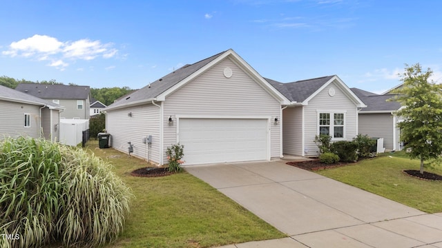 119 Yadkin St, Clayton, NC 27520 - view of front of house with an attached garage, driveway, and a front lawn