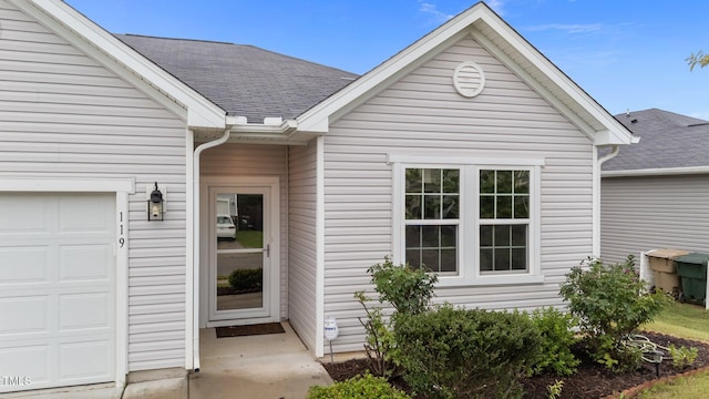 119 Yadkin St, Clayton, NC 27520 - property entrance with an attached garage