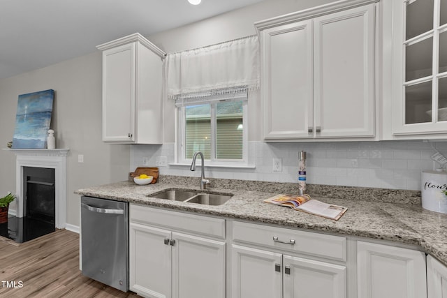119 Yadkin St, Clayton, NC 27520 - kitchen featuring dishwasher, tasteful backsplash, white cabinets, and light wood-style flooring