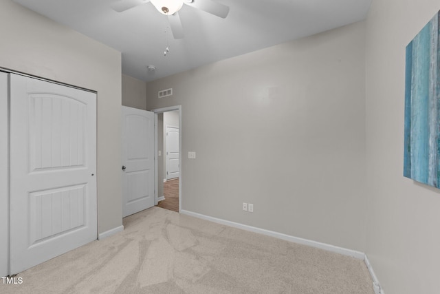 119 Yadkin St, Clayton, NC 27520 - unfurnished bedroom with carpet flooring, ceiling fan, and a closet