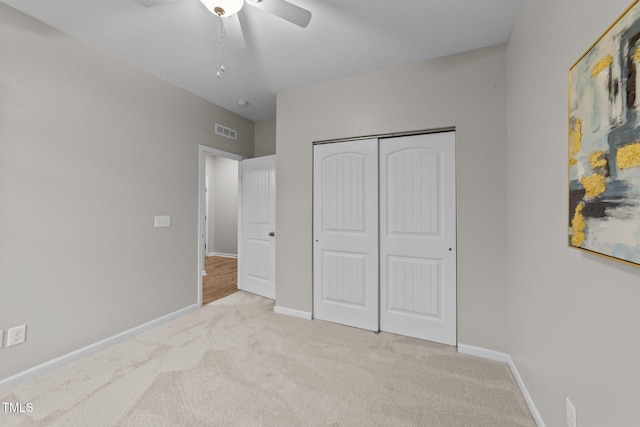 119 Yadkin St, Clayton, NC 27520 - unfurnished bedroom featuring carpet, a closet, and ceiling fan