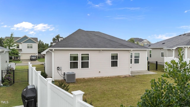 119 Yadkin St, Clayton, NC 27520 - back of house with a fenced backyard and a shingled roof
