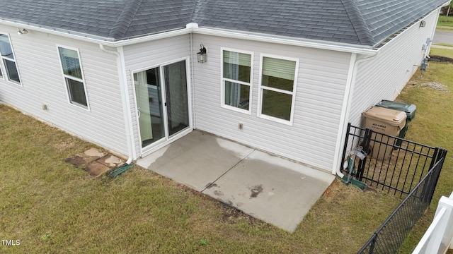 119 Yadkin St, Clayton, NC 27520 - back of property featuring roof with shingles and a patio area