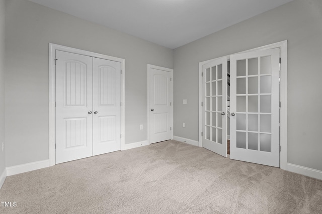 2057 Big Falls Dr, Wendell, NC 27591 - unfurnished bedroom with french doors, carpet, and a closet