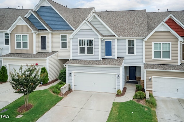 9 Moss Side Ter, Durham, NC 27703 - view of property with a garage, concrete driveway, and roof with shingles
