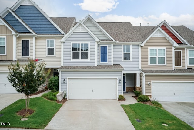 9 Moss Side Ter, Durham, NC 27703 - multi unit property featuring an attached garage, concrete driveway, roof with shingles, and a front yard