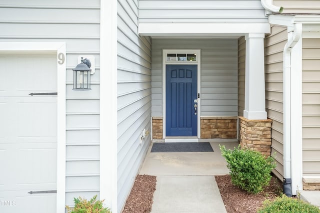 9 Moss Side Ter, Durham, NC 27703 - property entrance with stone siding and covered porch